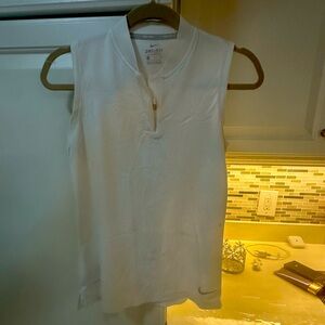 Small dri fit Nike small pink dot smudge left side